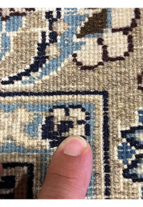 Macro of backside weave on Persian Nain 9LA Rug showing knot precision, wool texture, and blue-beige color transitions.