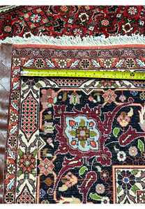 backside of 10x13 Bijar Persian rug with visible hand-knotted structure and dense weave