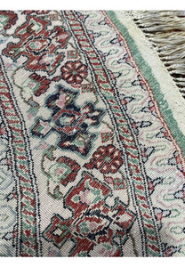 Backside view of Qum pure silk rug displaying fine weave, clear pattern visibility, and extremely tight knot structure.
