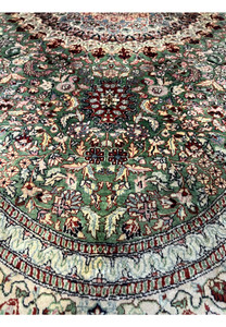 Lower border detail of the Persian Qum silk rug highlighting cream edging, floral repeats, and precise knot work.