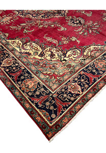 Edge close-up of the Patina Persian Tabriz Rug showing worn pile, border motifs, and texture variation.