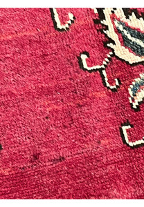 Documented worn spots on 10x13 vintage Persian Tabriz rug showing patina, thinning pile, and natural age-related wear in the red field.