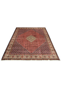 Laid down rare size Persian Bijar iron rug showing bold central medallion, rich red tones, layered borders, and powerful geometric symmetry