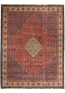Full view of rare size Persian Bijar iron rug with deep red field, ivory medallion, dense Herati pattern, and highly detailed floral border