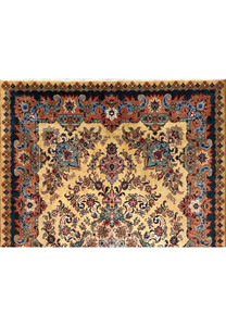 Upper section of Persian Tabriz rug showing floral cartouches in coral, teal and slate blue tones