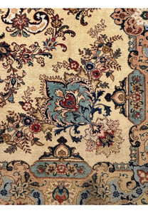 Detailed close up of floral vines with rust red, blush pink and moss green wool color accents