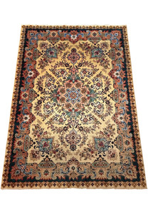 Top view of large Persian Tabriz rug showing ivory background, coral medallion and detailed floral vine structure