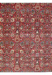 Detailed border of a 6'6 x 9'6 rare Persian Bijar iron rug with navy blue floral frame on red background
