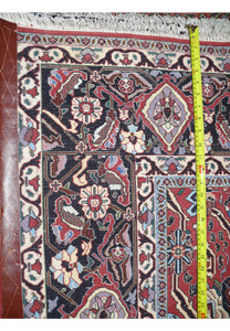 Backside of dense Bijar iron rug highlighting heavy wool pile, tight knot structure, and strong cotton foundation
