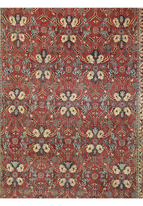 Close up floral motif on Bijar iron rug featuring ivory petals, navy contouring, sage green leaves, and antique gold accents