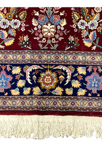 Lower border detail of Persian Isfahan rug with layered guard borders and floral design