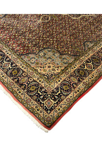 Outer and inner edge detail of Persian Bijar rug highlighting layered borders and tight woven construction