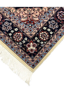 Side edge of Persian Tabriz rug showing clean binding and precise hand-knotted finish