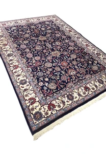 Angled view of Persian Sarough kork rug revealing pile texture and depth of navy blue field