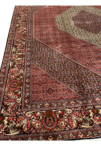 Inner border detail framing the diamond medallion in a hand knotted Persian Bijar iron rug