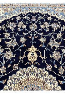 Upper section of a 6'5 x 10 Persian Nain 6 LA rug showing midnight navy field with ivory floral vines, silk highlights, and finely detailed curvilinear motifs