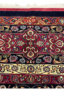 Upper edge of Persian Mashad rug displaying clean finishing, crisp borders, silk highlights, and traditional craftsmanship from the Sheshkalani workshop