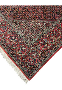 Outer edge detail of a Persian Bijar iron rug featuring strong binding, crisp borders, red wool edge finish, and long-lasting hand-knotted construction