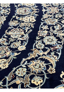 Detailed design view of a Persian Nain 6 La rug showing intricate floral elements and precise silk detailing