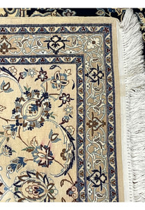 Backside of a Persian Nain 6 La rug revealing tight knot structure, fine weave density, and silk foundation