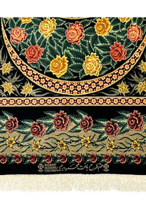 Woven signature detail on a Persian Qum pure silk rug reading Mahmoud Rajabi, placed above the fringe and framed by floral motifs and Iranian origin marks