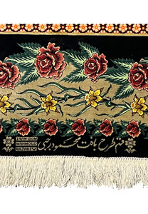 Zoomed signature close-up of a signed Persian Qum silk rug showing Mahmoud Rajabi inscription, silk clarity, and tight knot structure near the fringe