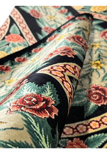 Face and foundation close-up of a Persian Qum pure silk rug showing extremely fine knot structure, uniform weave, and precise silk craftsmanship