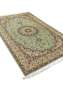 Angled perspective of a Mirmehdi Persian Qum silk rug emphasizing silk luster, sage green tones, floral medallion, and elegant proportions