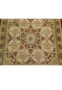 Central medallion detail of signed Amjadi Persian Qum silk rug highlighting star geometry, floral rosettes, and crisp silk knot precision