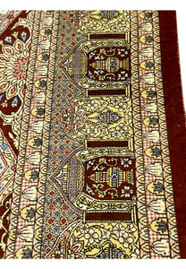 Zoomed border detail of signed Amjadi Persian Qum silk rug highlighting architectural motifs, floral accents, and precision silk knotting