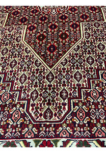Face and foundation close-up of Persian Senneh rug revealing tight knot structure, clean weaving, precise color changes, and durable wool build
