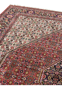Inner border and ivory field detail of Persian Bijar rug showing dense geometric motifs, crisp outlines, and balanced contrast with brick red sections