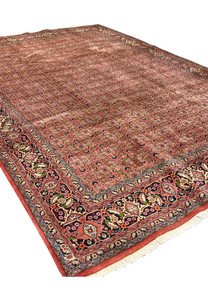 Angled perspective of Persian Bijar rug emphasizing heavy wool pile and firm traditional construction