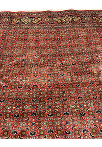 Upper section of Persian Bijar rug showing consistent weave density and harmonious color distribution