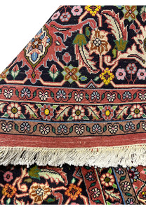 Backside corner of Persian Bijar rug with visible warp, weft, and natural fringe showcasing authentic hand-knotted weave