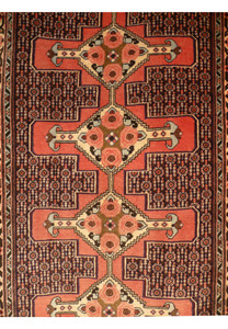Detailed field section of handmade Persian runner with repeating boteh style forms and dense fine knot weaving