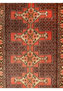 Close view of Senneh runner showing coral medallions lattice pattern navy ground and intricate geometric floral details