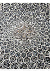 Close view of Nain 6 LA Gombadi dome medallion with silk floral details ivory and navy field fine Habibian craftsmanship.
