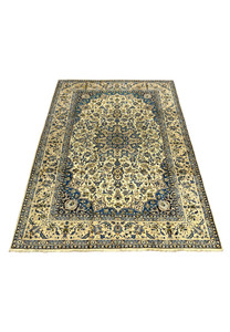 Large 10'2 x 14'3 Persian Kashan rug laid down showing ivory floral field deep navy border and symmetrical medallion design