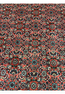 Detailed patterns and motifs of 8'2 x 11'4 Persian Bijar Iron Rug showing compact geometric floral design in red, ivory and navy tones
