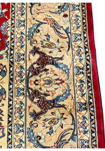 Animal motif closeup 10x13 Persian Isfahan wool rug brown deer on ivory border blue floral surround crimson field