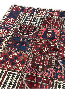 Upper edge and ivory fringe detail of 7x10 hand-knotted Persian Bakhtiari panel rug