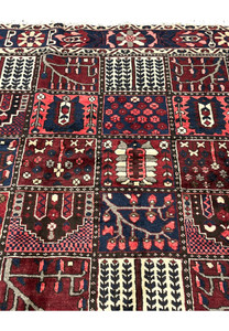 Zoomed panel detail showing weeping willow and flowering shrub compartments in 6'8x10 Bakhtiari rug