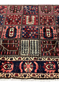 Khane panel detail of 7x10 Persian Bakhtiari wool rug with arched niches and flowering shrubs