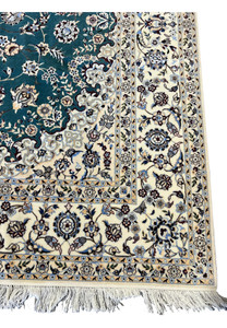 Ivory main border with floral vine on 7x10 Persian Nain 6La Habibian teal and ivory rug