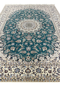 Teal field floral vine detail of 7x10 Persian Nain 6La Habibian wool and silk rug