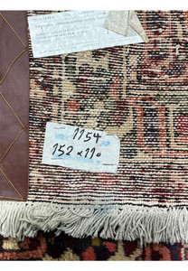 Back of antique 3'7"x5 Persian Bakhtiari rug showing hand-knotted wool construction and age