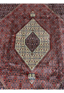 Ivory hexagonal medallion with navy inner diamond, central design of 10x13 Bijar rug