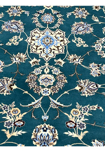 Classical Nain floral motifs including palmettes rosettes and arabesque vines in silk and wool