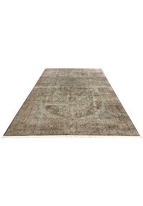 Top-down view of this large Turkish pure silk rug showing full medallion composition and dense floral tracery